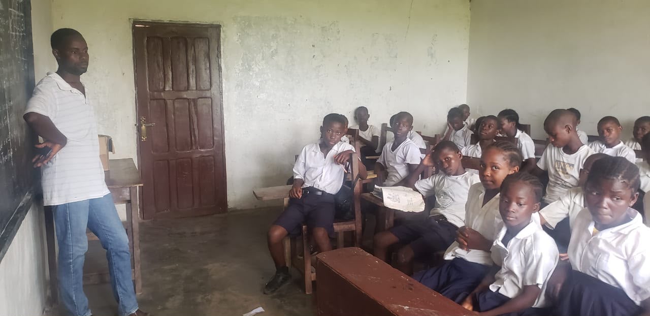 A teacher and students inside a Jovan Public School classroom